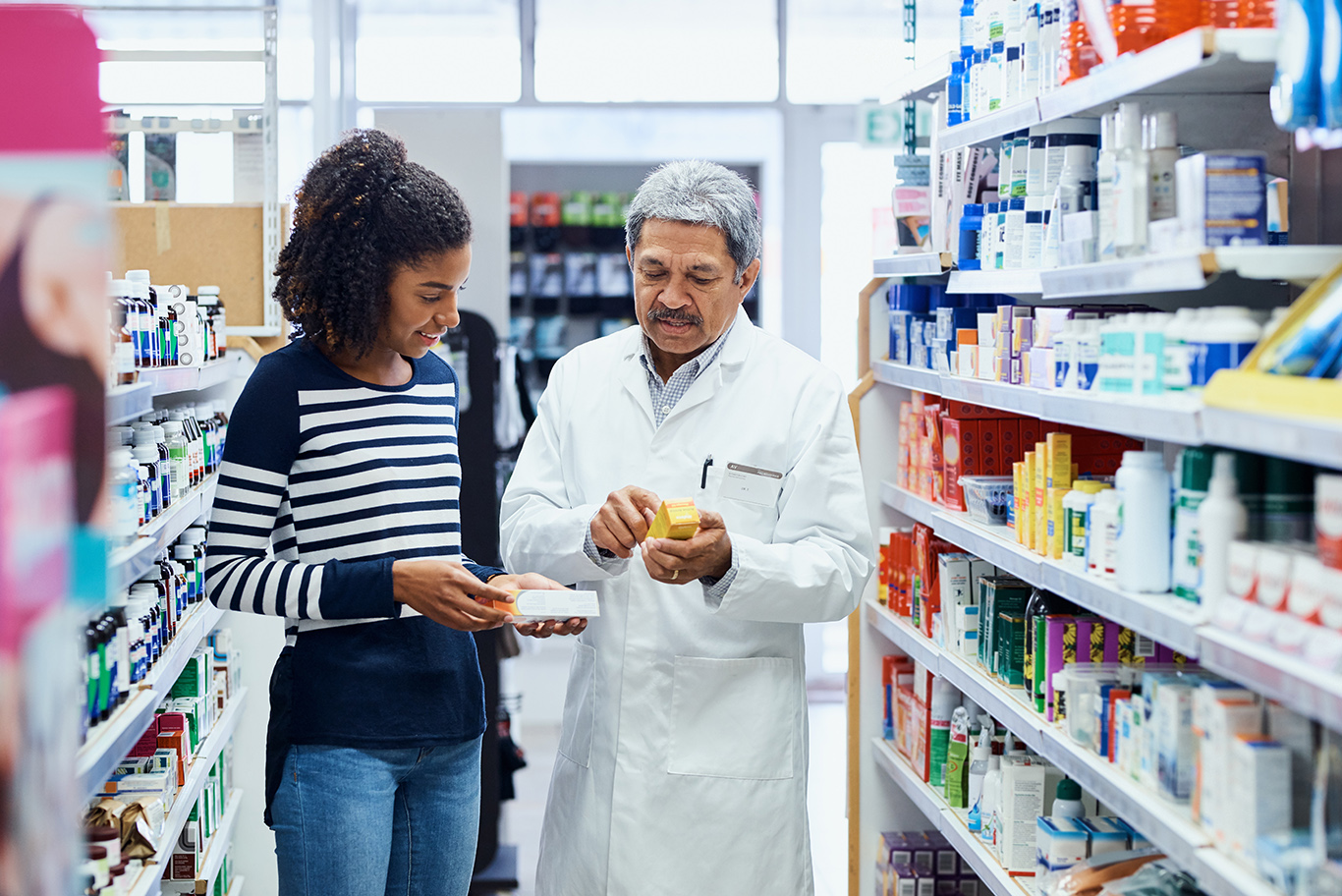 Consumer and pharmacist in pharmacy setting